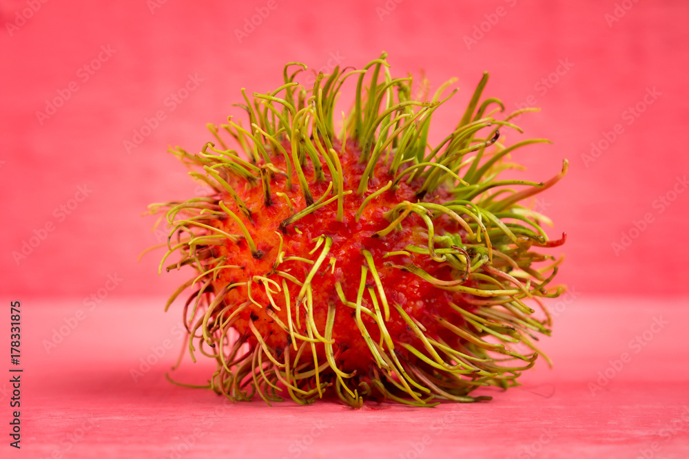 rambutan fruit on wood color pink rambutan fruit on wood color pink