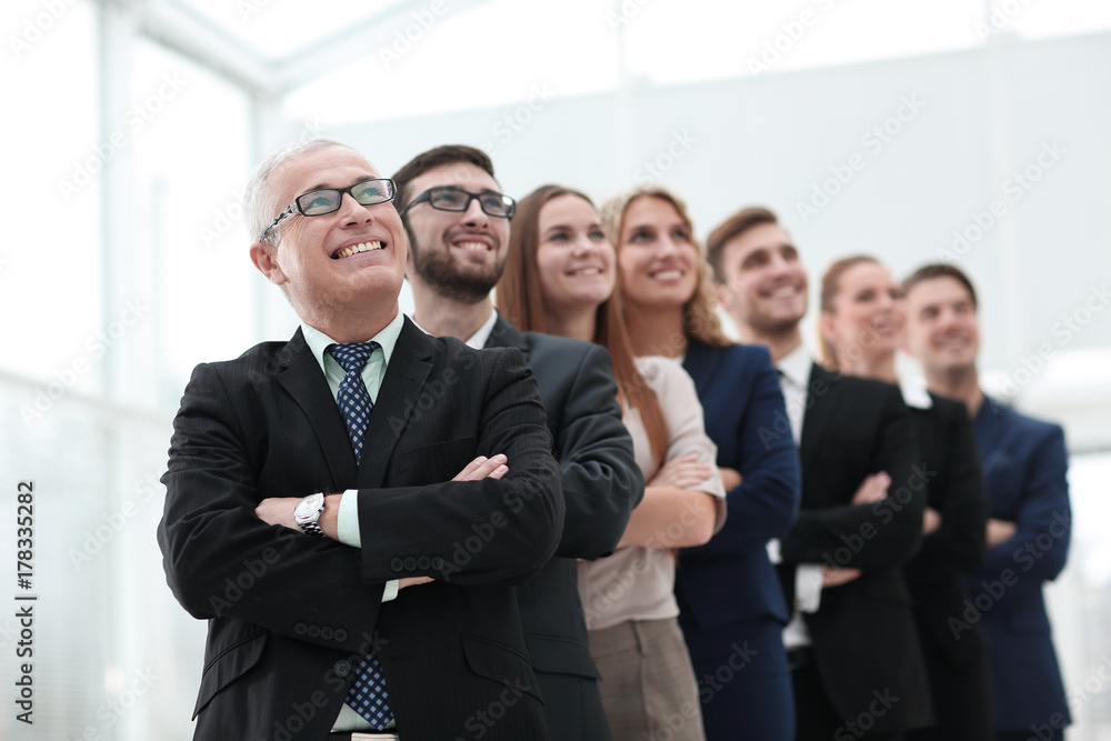 senior businessman and his team are confident looking ahead. senior businessman and his team are confident looking ahead.