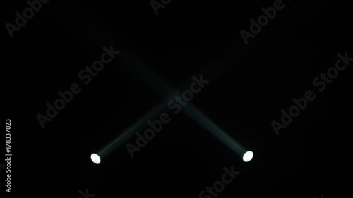 Realistic footage of stage light flashing rays spotlights through smoke. Great as a natural stage background for different projects!!! photo