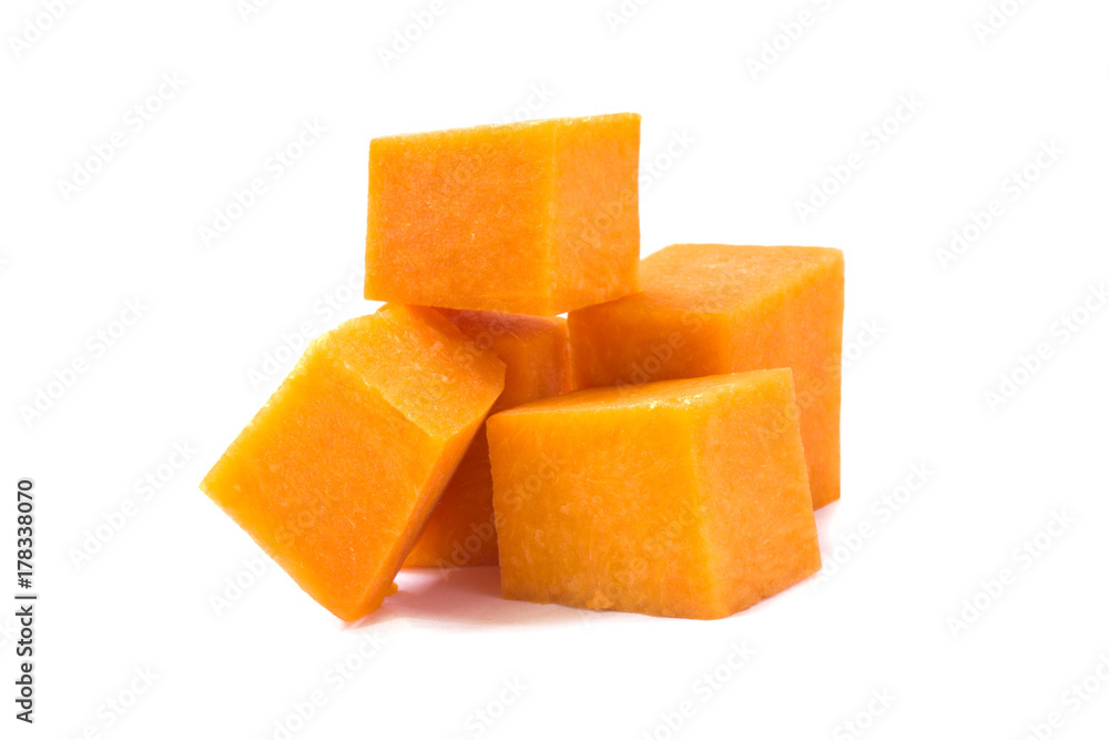 a bunch of sliced squares of ripe pieces of pumpkin a bunch of sliced squares of ripe pieces of pumpkin