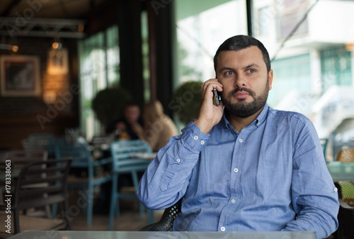 Handsome man talking on the phone
