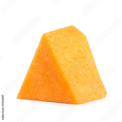 one cut triangular piece of ripe pumpkin