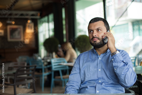 Handsome businessman using phone © Eightshot Images