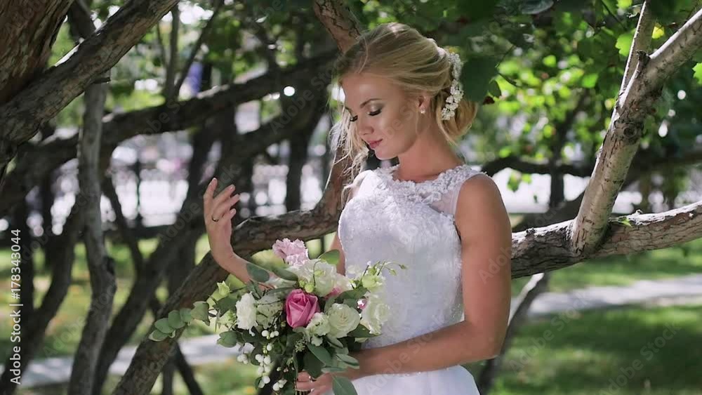 portrait of a bride close-up on wedding day. walk in the park portrait of a bride close-up on wedding day. walk in the park
