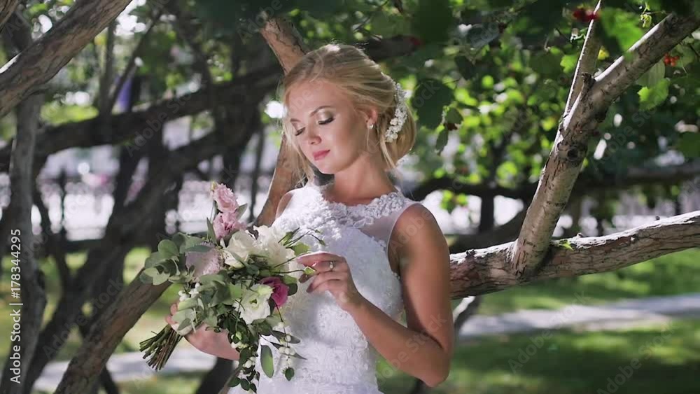 portrait of a bride close-up on wedding day. walk in the park portrait of a bride close-up on wedding day. walk in the park