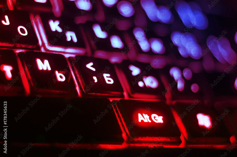 Computer keyboard glows red with a blue illuminated euro symbol. News Photo  - Getty Images