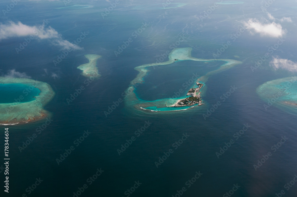 Tropical islands and atolls in Maldives in Indian Ocean from aerial view.  Piece of paradise on the Earth. Good choice for vacation. Beautiful top  view for wallpaper. Stock Photo | Adobe Stock