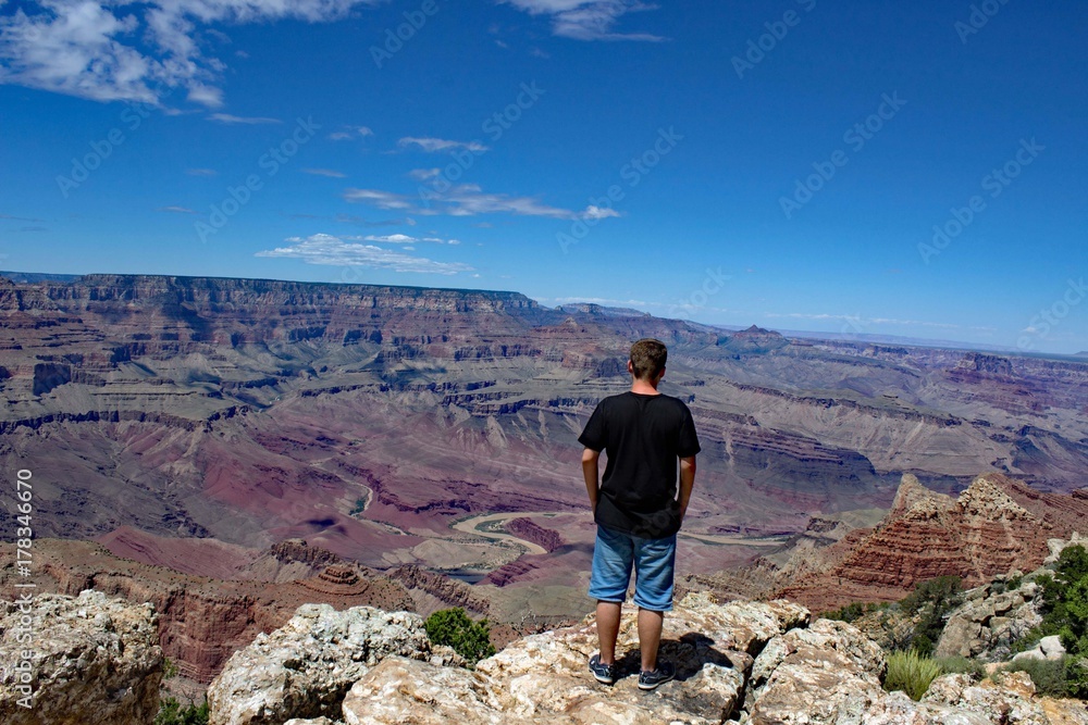 Boy standing at the South Rim of Grand Canyon