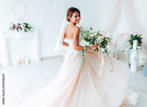 Fotobehang beautiful bride in a luxurious dress in eco-style