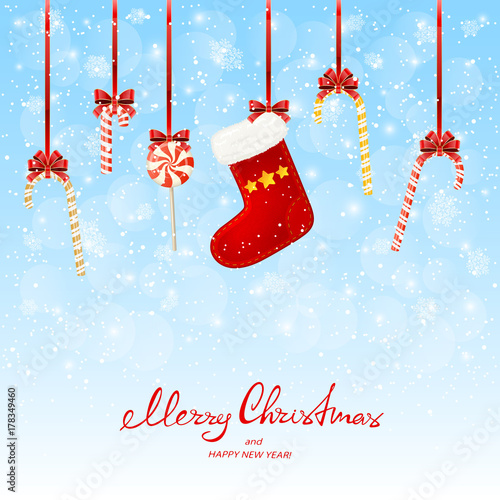 Holiday decorations with lollipops and Christmas stocking on snowy background