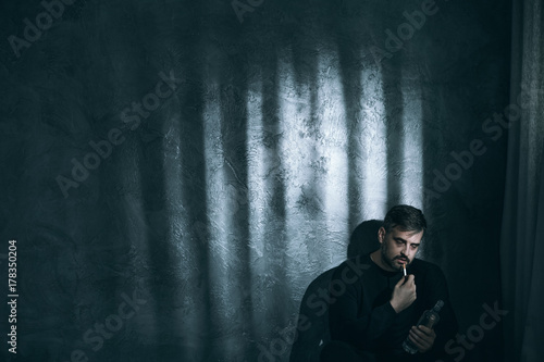 Fototapeta Naklejka Na Ścianę i Meble -  Adult man smoking cigarette
