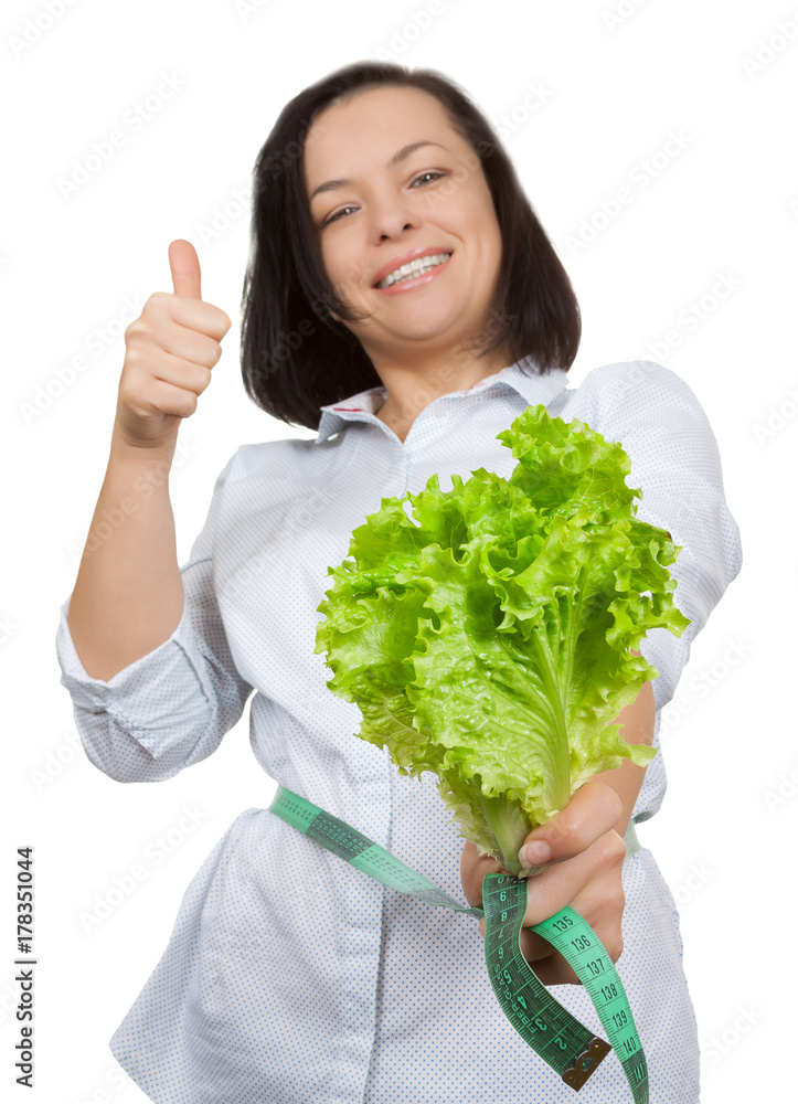 Diet Concept. Young Woman with Lettuce Measuring Her Waistline with Measure Tape Diet Concept. Young Woman with Lettuce Measuring Her Waistline with Measure Tape