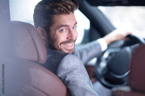 Successful man sitting behind the wheel of a prestigious car © ASDF