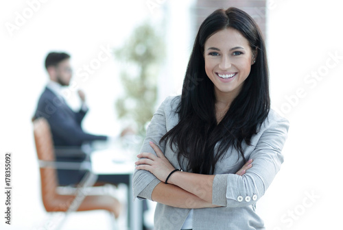 successful young business woman on the office background