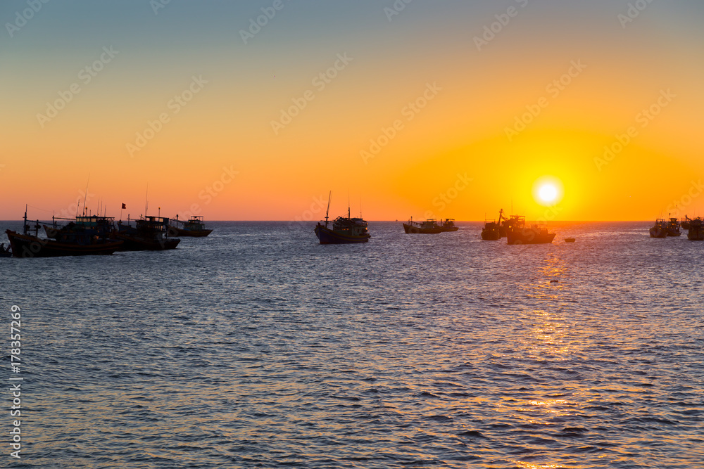Vietnam village fishing boats ships sunset light