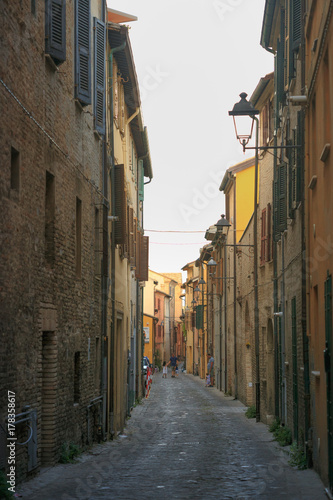 Fano, Italy - August 8, 2017: Narrow streets of the old city at night sometimes. photo