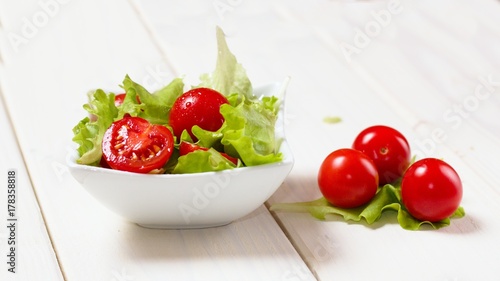 Small bowl of lettuce and tomato salad