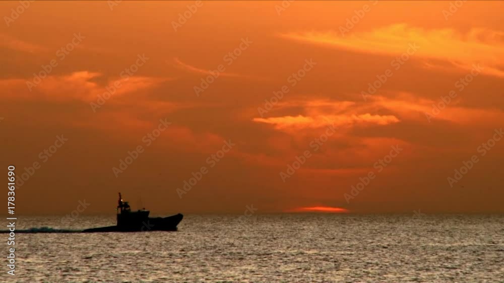 Police boat sailing at sunset Police boat sailing at sunset