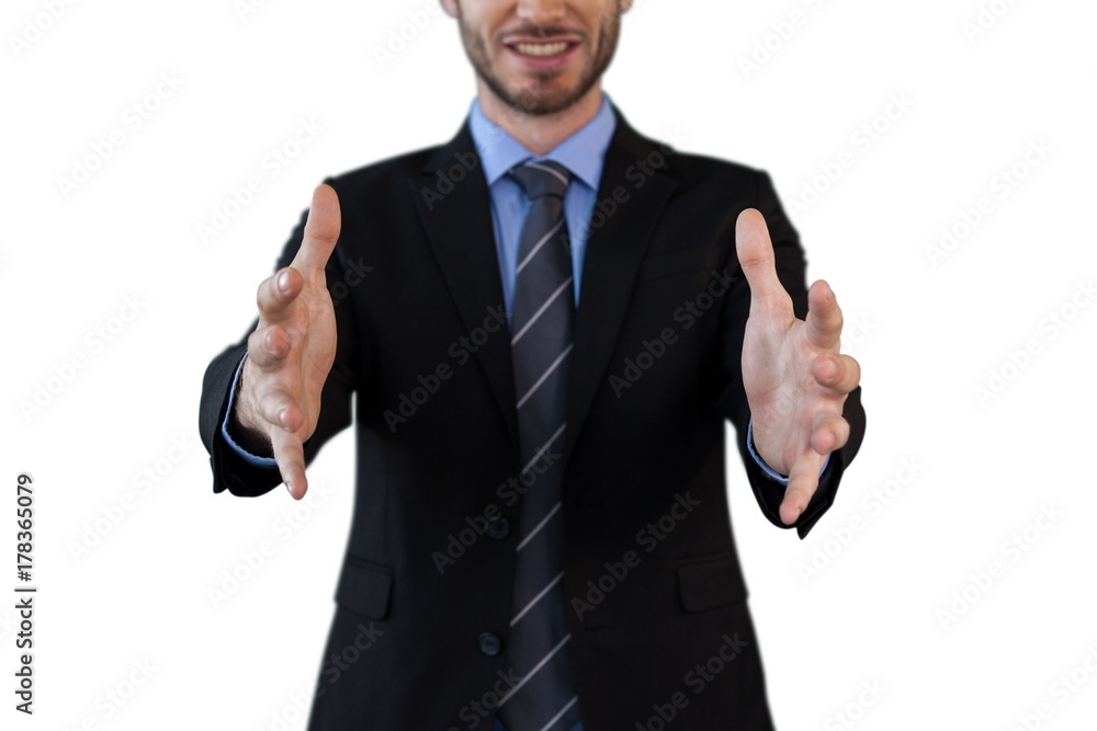Mid section of smiling businessman in suit marketing invisible Mid section of smiling businessman in suit marketing invisible