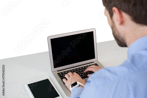 High angle view of businessman using laptop