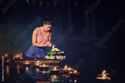 Loy Krathong Traditional Festival, Thai woman hold kratong, Thailand, Asia woman in Thai dress traditional hold kratong and bring Krathong to float in Loi kratong day of Thailand. photo