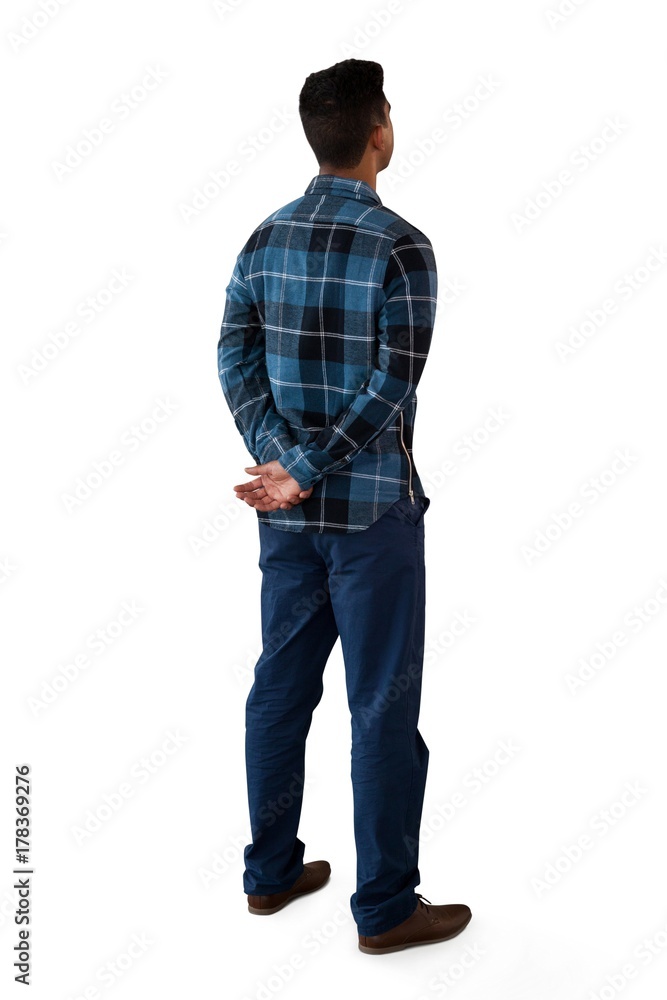Rear view of man with hands behind back Rear view of man with hands behind back