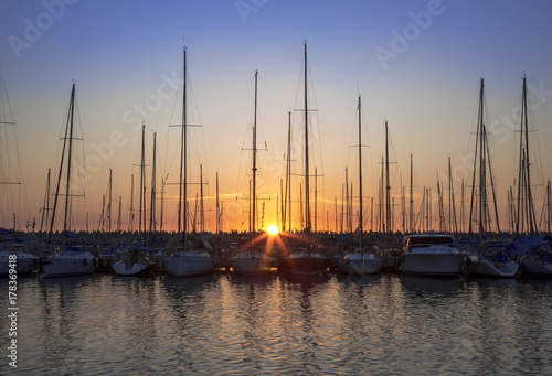 yachts at the pier at sunset