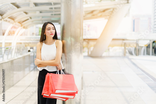Beautiful young woman hold shopping bags at outdoor.