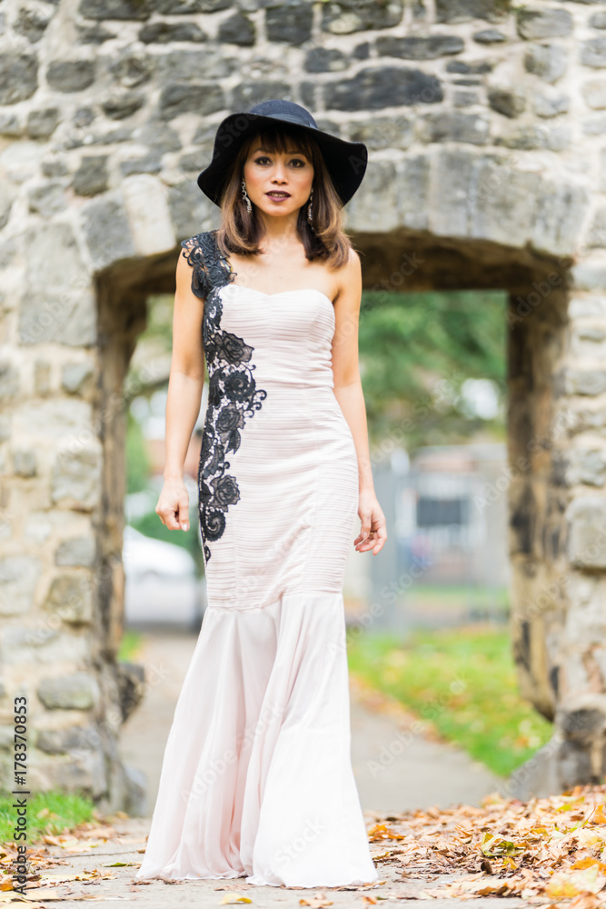 Filipino model in a local park at Autumn time surrounded by lush foliage at daytime Filipino model in a local park at Autumn time surrounded by lush foliage at daytime