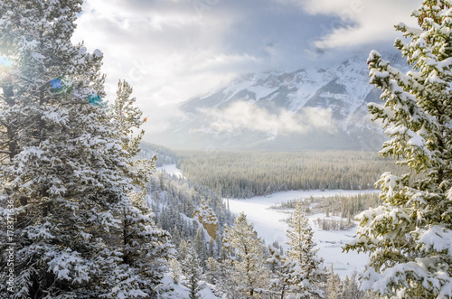 View of Bow River Valley in Banff National Park on a Snowy Winter Day. Lens Flare.