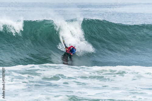 Bodyboarder surfing ocean wave