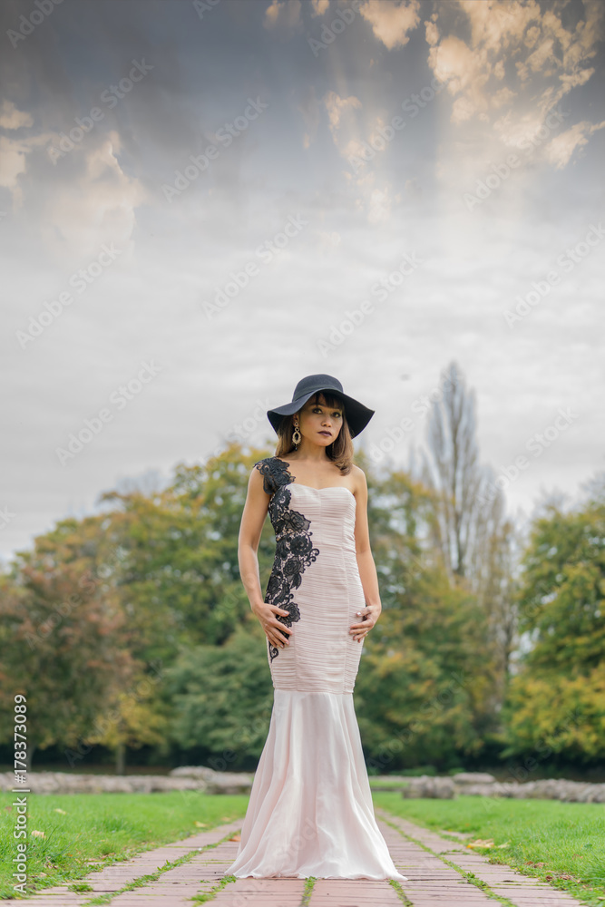 Filipino female model at Autumn time in a park during the daytime, with lush foliage all around. Filipino female model at Autumn time in a park during the daytime, with lush foliage all around.