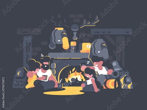 Friends sitting by fireplace