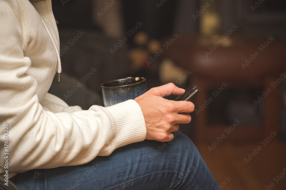 Woman Relaxing with Coffee and Using Cell Phone Woman Relaxing with Coffee and Using Cell Phone