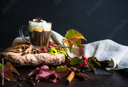 Autumnal concept with yellow leaves and coffee