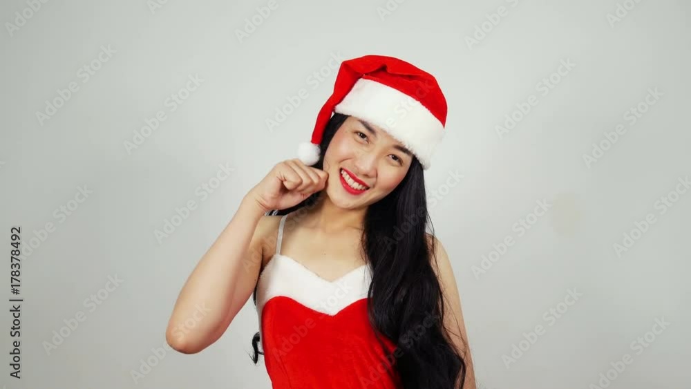 Sexy Girl in Santa Claus Costume for Christmas. Pretty happy girl in santa claus helper hat Sexy Girl in Santa Claus Costume for Christmas. Pretty happy girl in santa claus helper hat