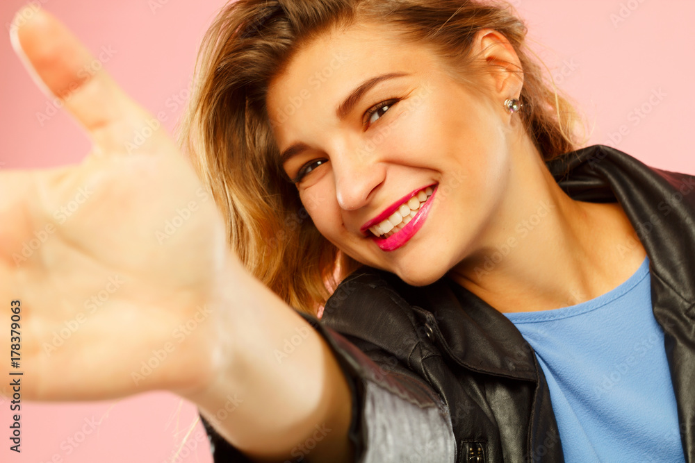 Portrait of a beautiful young woman making selfie on smart phone. Happy young woman photographing herself. Portrait of a beautiful young woman making selfie on smart phone. Happy young woman photographing herself.