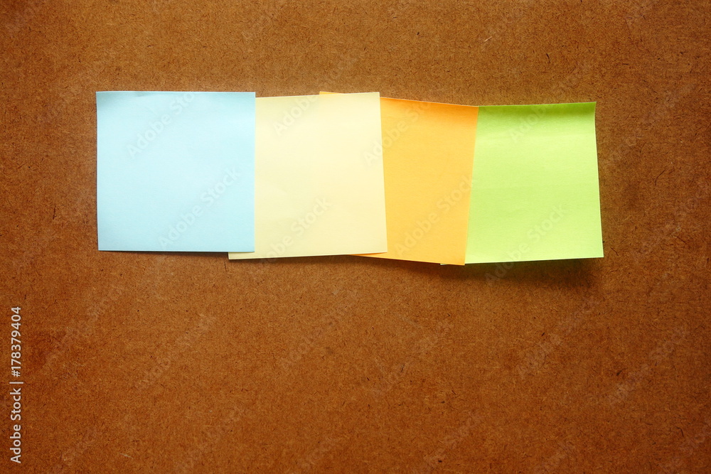 colorful post it paste on brown wood background have copy space for put text to do list colorful post it paste on brown wood background have copy space for put text to do list
