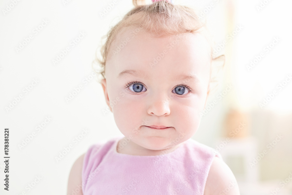 Happy little child girl sit on white towel happy emotion and face expression 