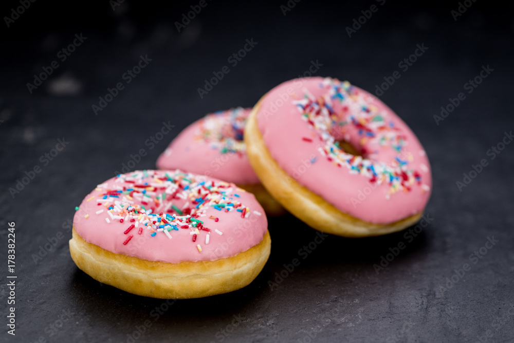 Pink glazed Donuts (close-up shot) Pink glazed Donuts (close-up shot)