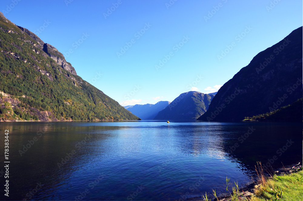 Blue water of Geirangerfjord as seen from the town Hellesylt, More og Romsdal, Norway