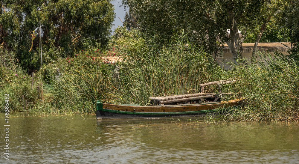 group of traditional wooden boats. Latin sailing ships, in the harbor of the Albufera in Valencia Spain