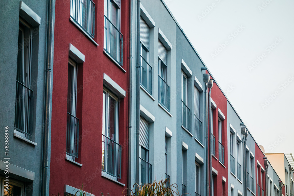 Naklejka premium low colored picture of modern townhouses