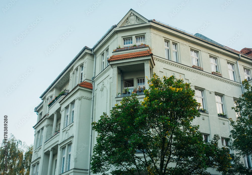 Fototapeta premium grey old apartment building in vintage colors