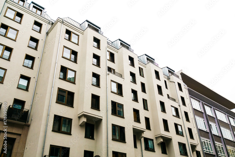 Fototapeta premium white apartment complex with square formed facade