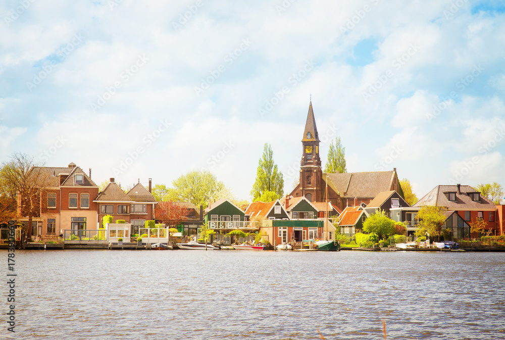 rural dutch scenery of Zaandijk waterfront, Netherland, retro toned