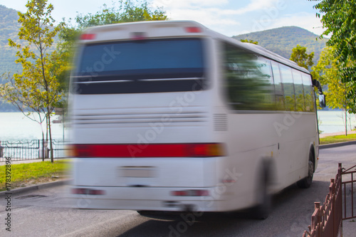 tourist bus moves along the road