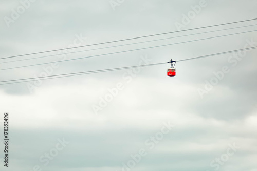 Red cable car in the sky