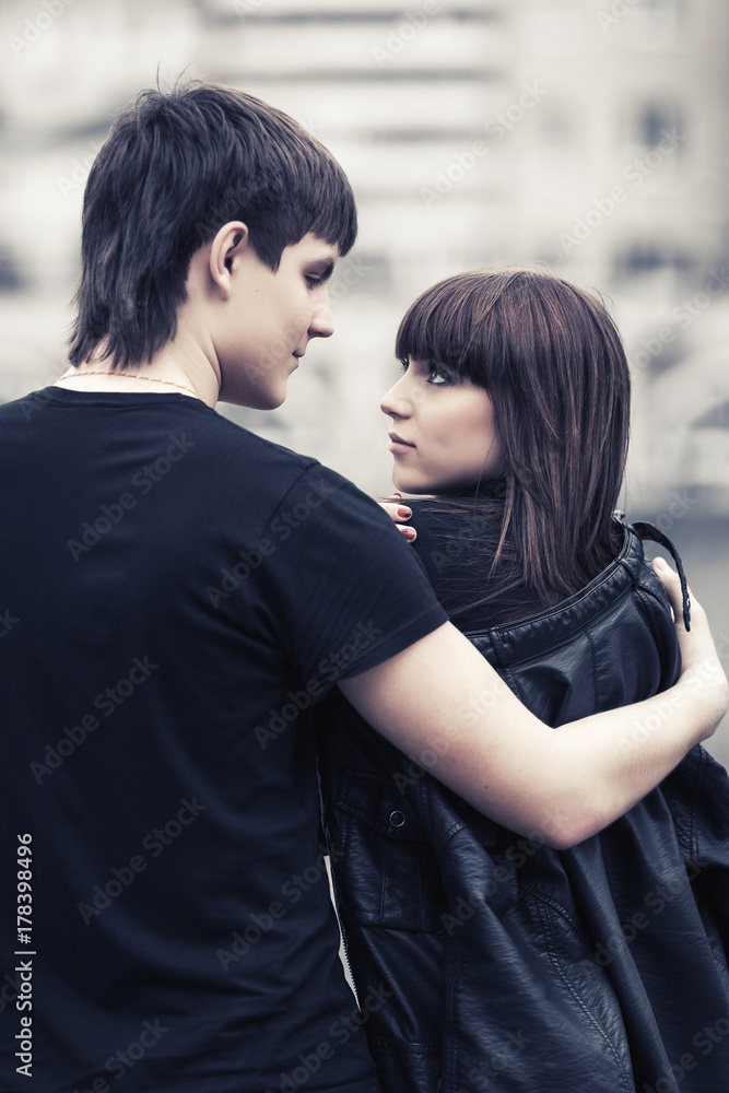 Happy young couple in love in city street Happy young couple in love in city street