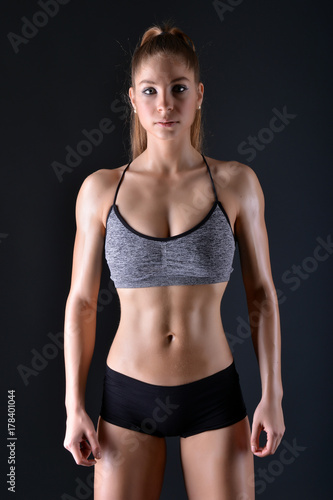 Beautiful young sporty sexy woman showing muscle  © muro